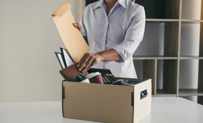 A worker packing up their things