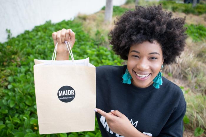 MSc Entrepreneurship Leyanis Diaz Gil with a bag from her startup - Major Marketplace. Leyanis has been chosen for the WBENC Student Entrepreneur Programme in 2019