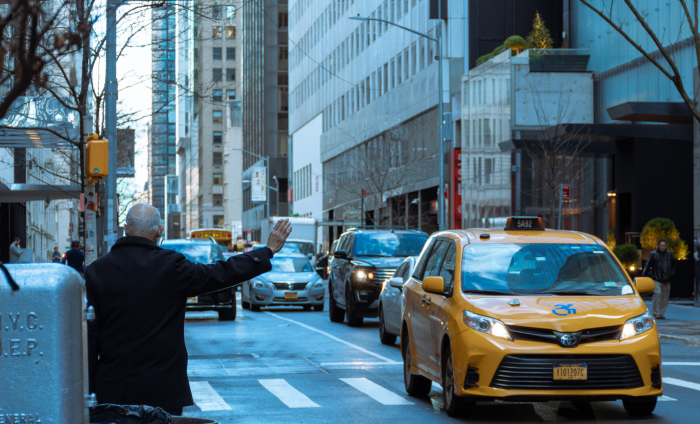A man hails a taxi