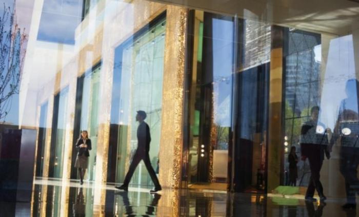 Business people walking through the lobby of an office